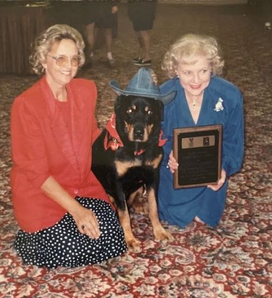 Two women and award-winning Rottweiler.